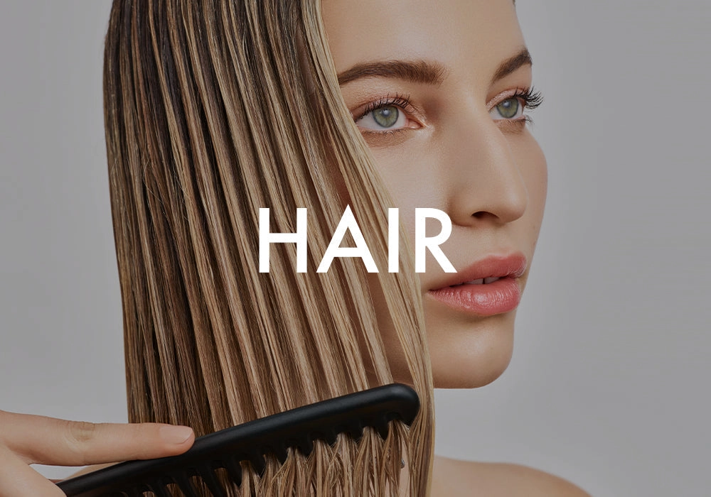 HAIR: a comb pulled through long straight blonde hair